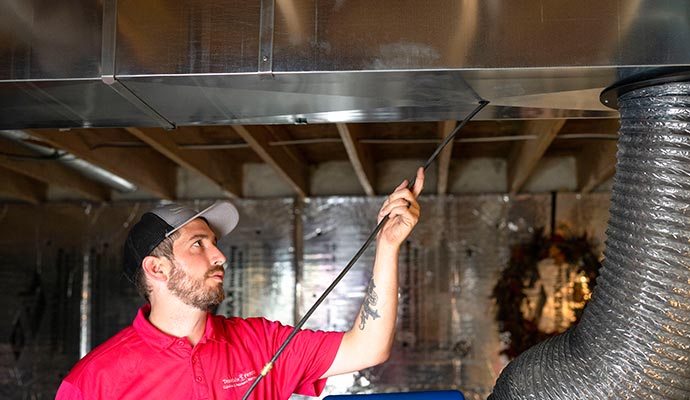 Person cleaning air duct waste