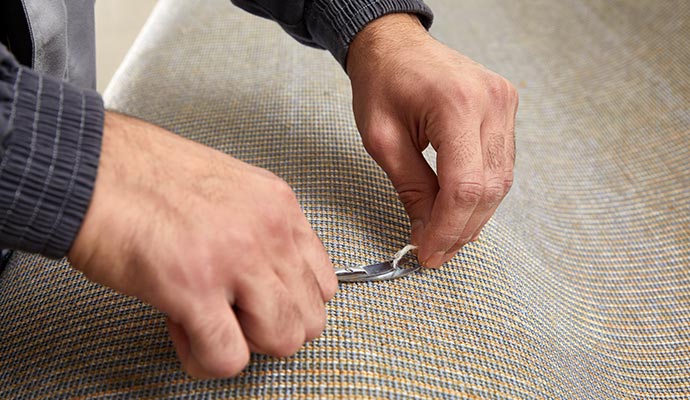 Professional carpet repair using equipment