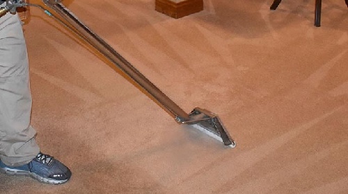 Professional carpet cleaning using equipment