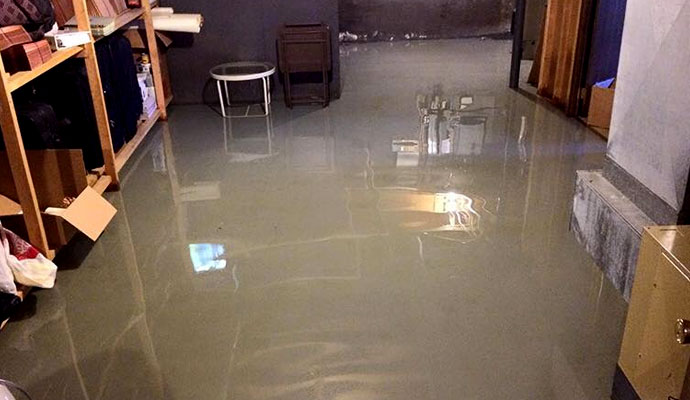 storm damaged room flooded with water