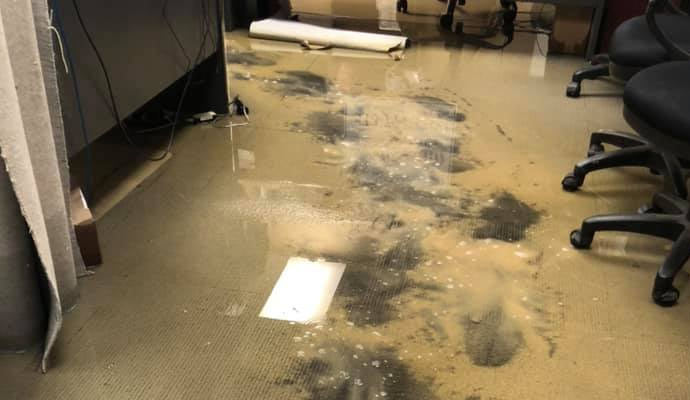 An office floor that has suffered water damage.